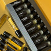 Collection of black and yellow vials with labels on a yellow background